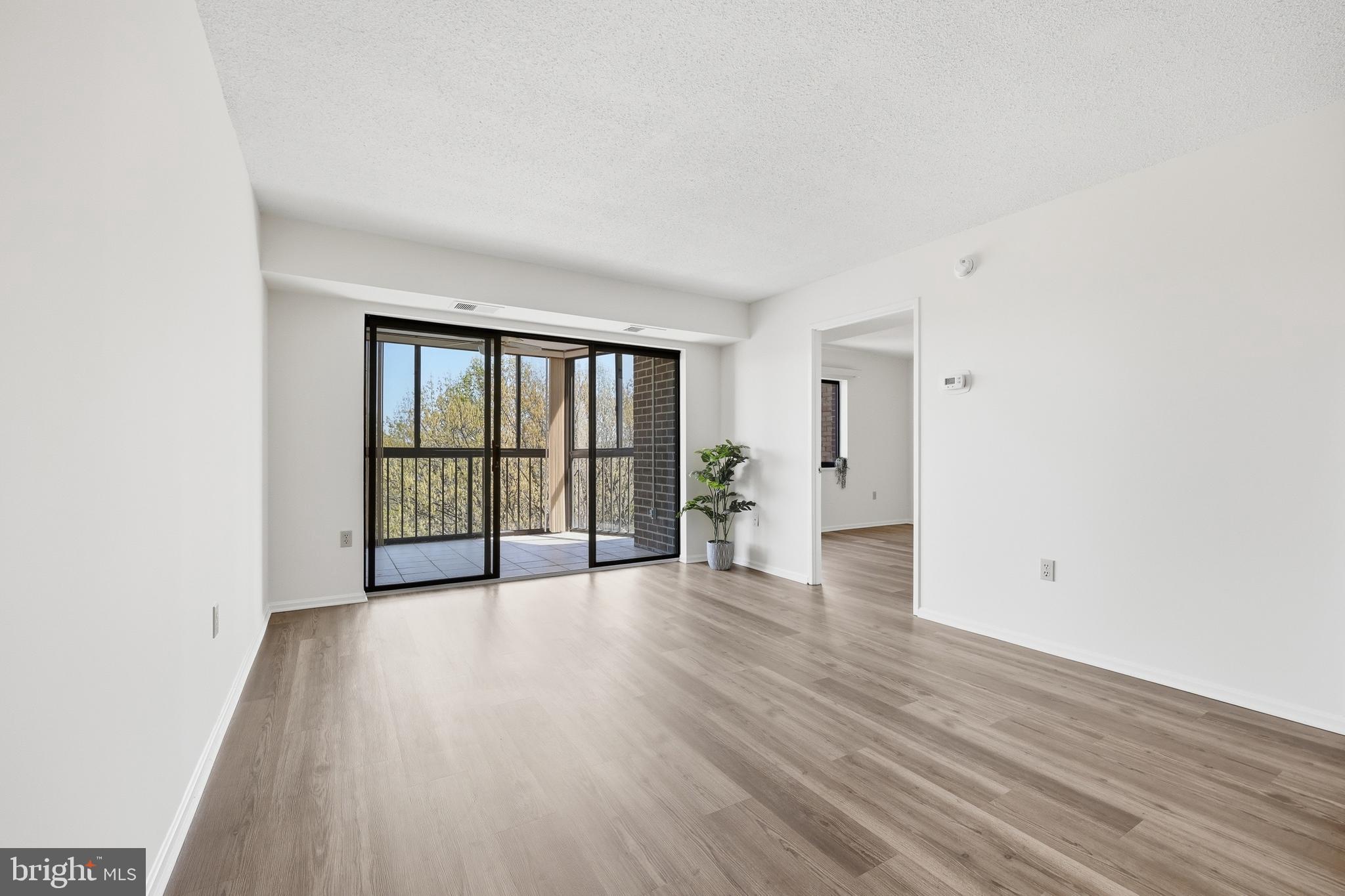 15107 Interlachen Drive, Unit 21006 Silver Spring, MD 20906 - Photo 10 of 29 Living Room, to the balcony