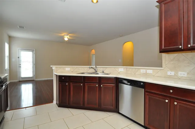 a kitchen with a sink and cabinets