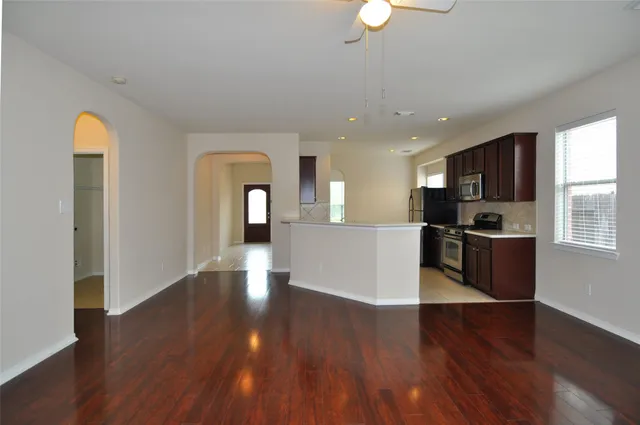 a view of kitchen with cabinets and wooden floor