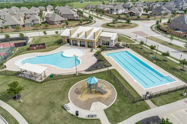 an aerial view of a house with outdoor space