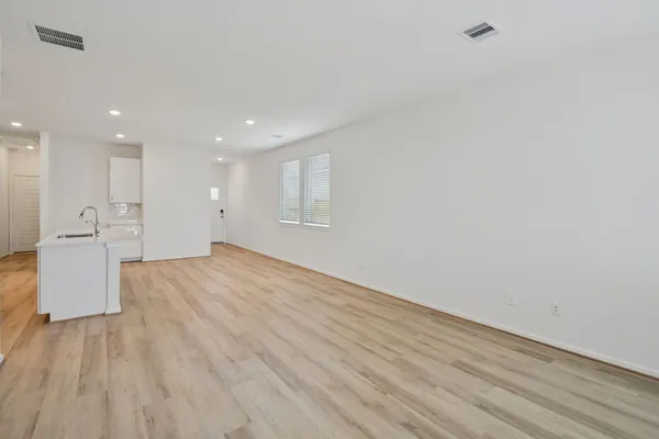 a view of kitchen with granite countertop cabinets and steel stainless steel appliances