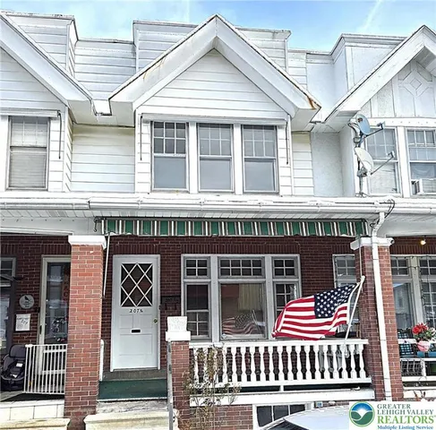 a front view of a house with a porch