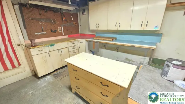 a view of a storage room with water heater and racks