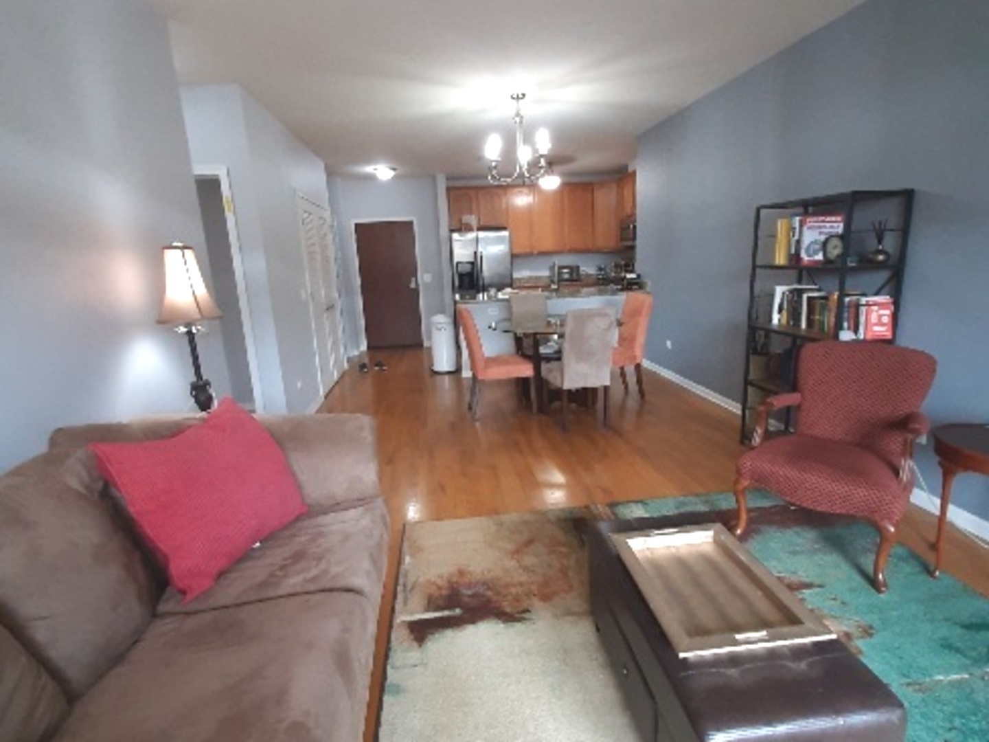 6436 Roosevelt Road, Unit 209 Oak Park, IL 60304 - Photo 13 of 25 a living room with furniture and a dining table with kitchen view