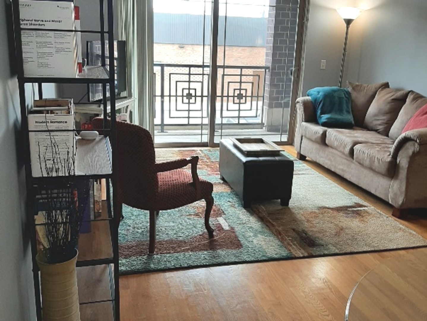 6436 Roosevelt Road, Unit 209 Oak Park, IL 60304 - Photo 14 of 25 a living room with furniture and a floor to ceiling window
