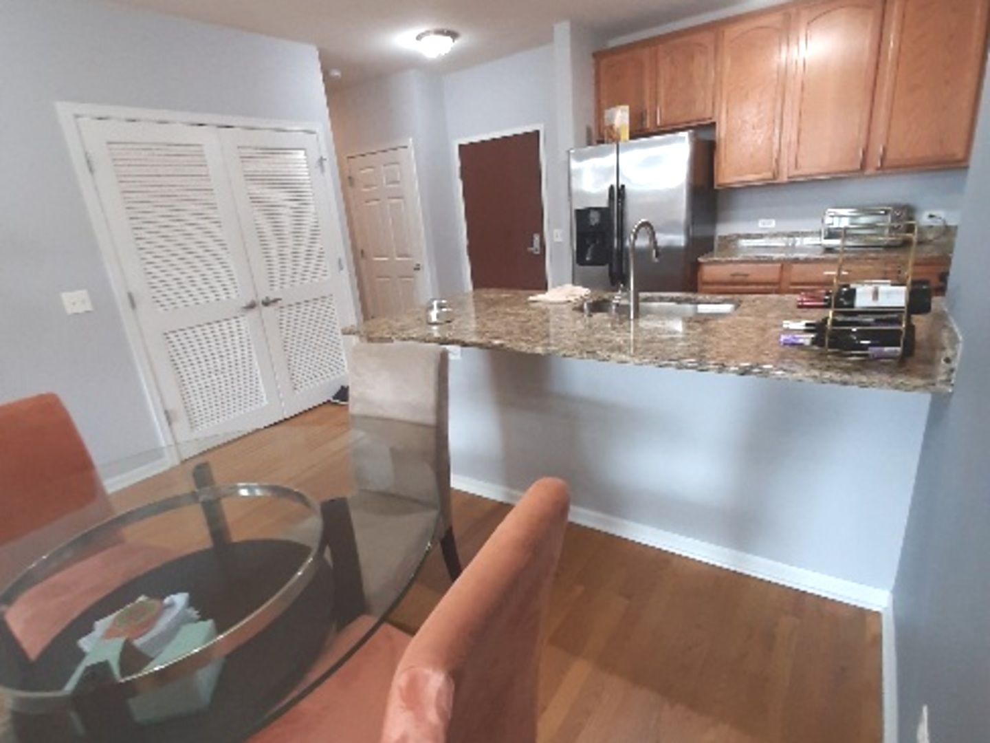 6436 Roosevelt Road, Unit 209 Oak Park, IL 60304 - Photo 9 of 25 a kitchen with stainless steel appliances granite countertop a sink a stove and a refrigerator