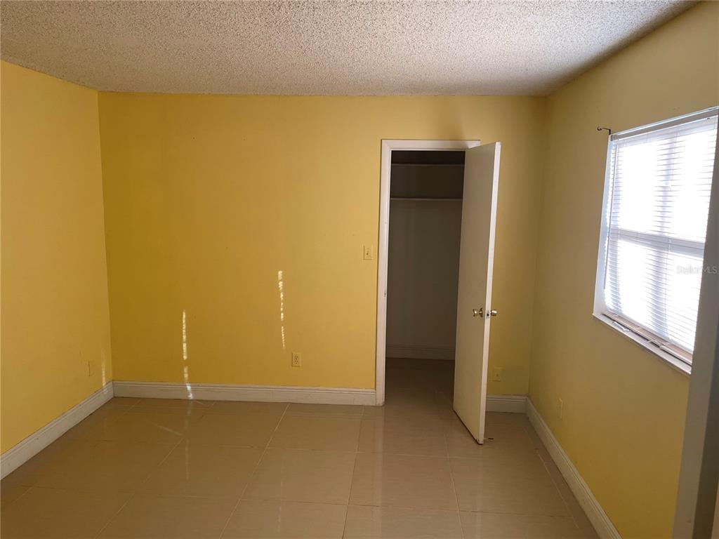 7352 Balboa Drive, Unit 7352 Orlando, FL 32818 - Photo 6 of 6 a view of an empty room with a window