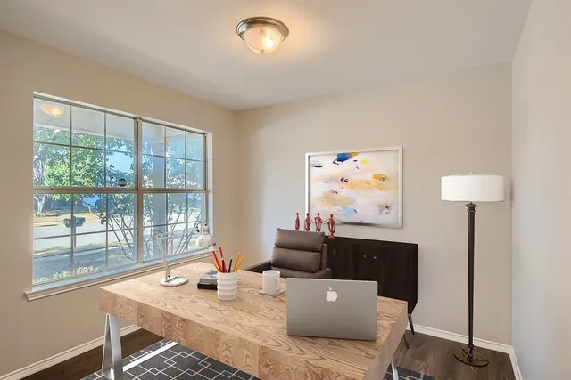 a work room with furniture and a window