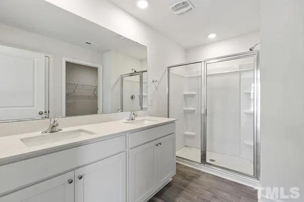 a bathroom with a sink toilet tub and shower