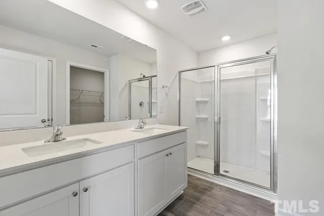 a bathroom with a sink toilet tub and shower