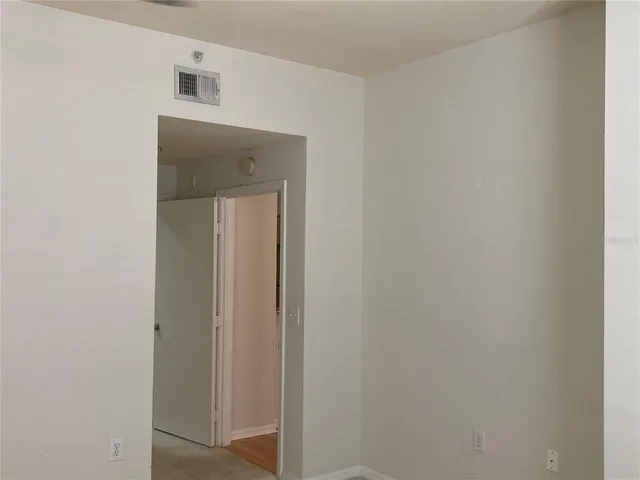 a view of a hallway with closet