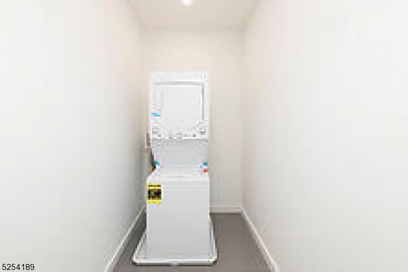 125 Broughton Avenue, Unit 2 Bloomfield, NJ 07003 - Photo 7 of 9 a room with a utility room