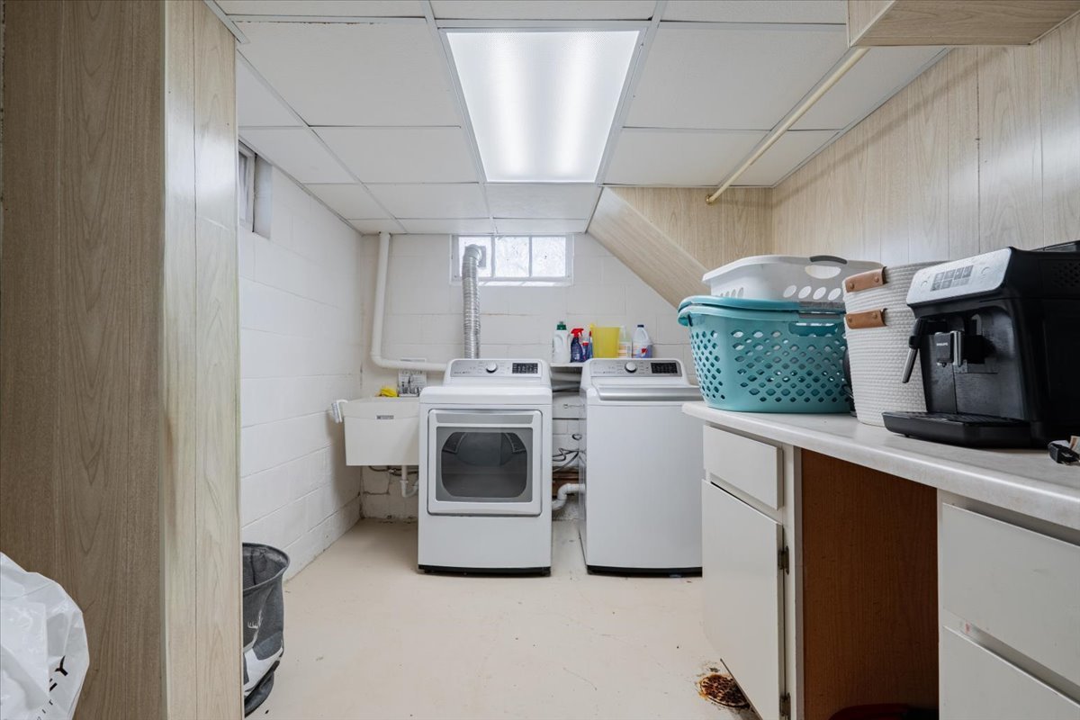 413 Grant Street Normal, IL 61761 - Photo 24 of 40 a utility room with sink dryer and washer