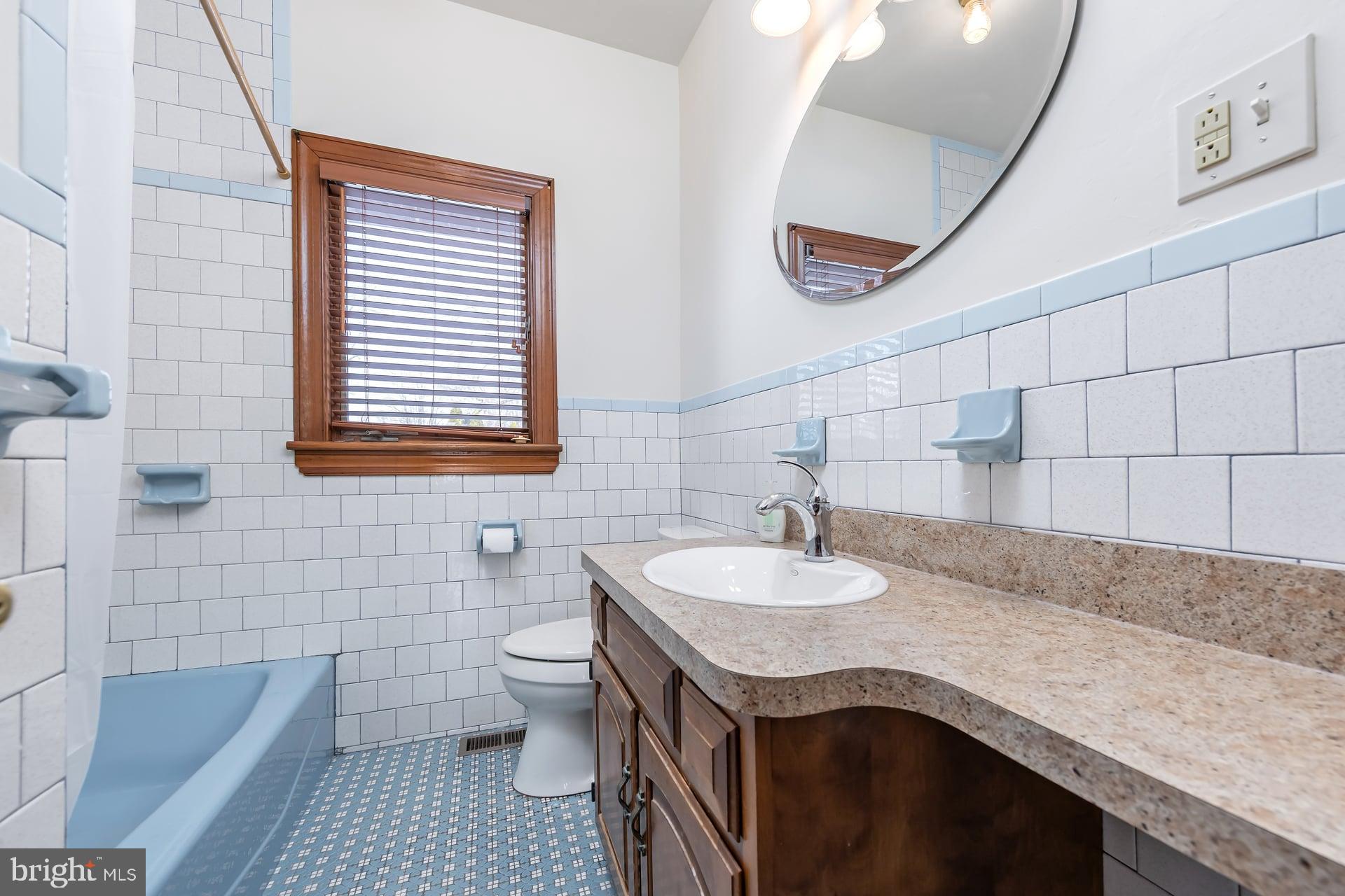 175 Queen Street West Deptford, NJ 08086 - Photo 13 of 23 a bathroom with a granite countertop sink and a toilet