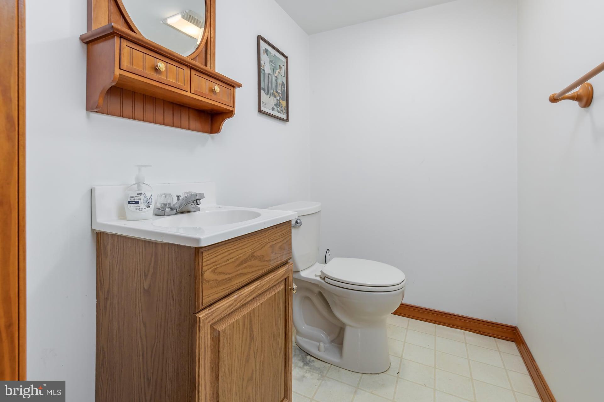 175 Queen Street West Deptford, NJ 08086 - Photo 18 of 23 a bathroom with a sink and a toilet