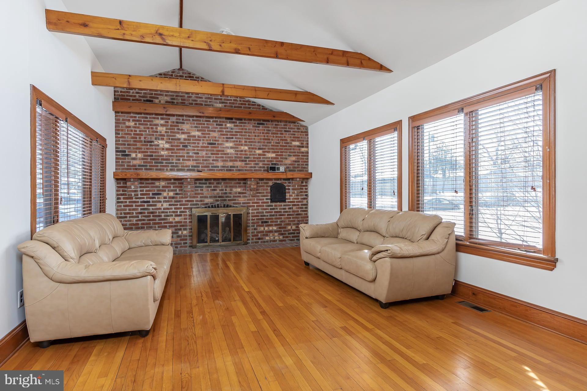 175 Queen Street West Deptford, NJ 08086 - Photo 2 of 23 a living room with furniture and a fireplace