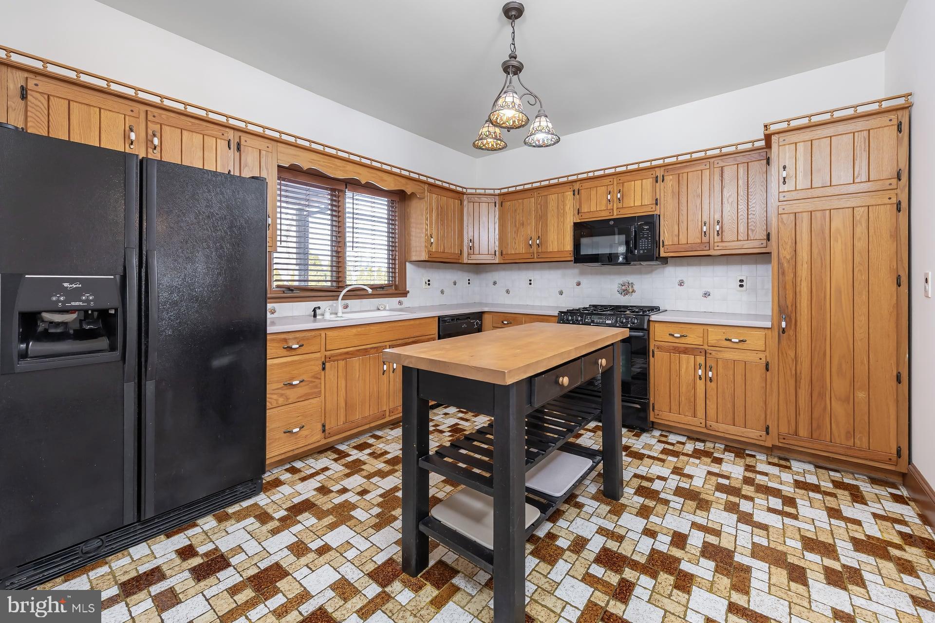 175 Queen Street West Deptford, NJ 08086 - Photo 6 of 23 a kitchen with a sink a stove a refrigerator and a cabinets
