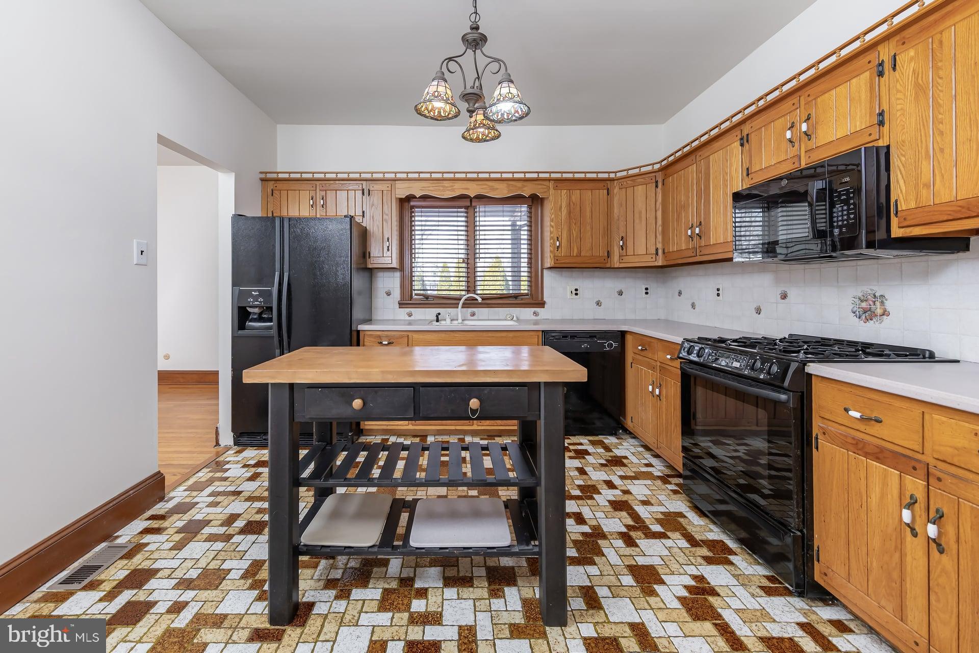 175 Queen Street West Deptford, NJ 08086 - Photo 7 of 23 a kitchen with stainless steel appliances granite countertop a stove a sink dishwasher and a refrigerator