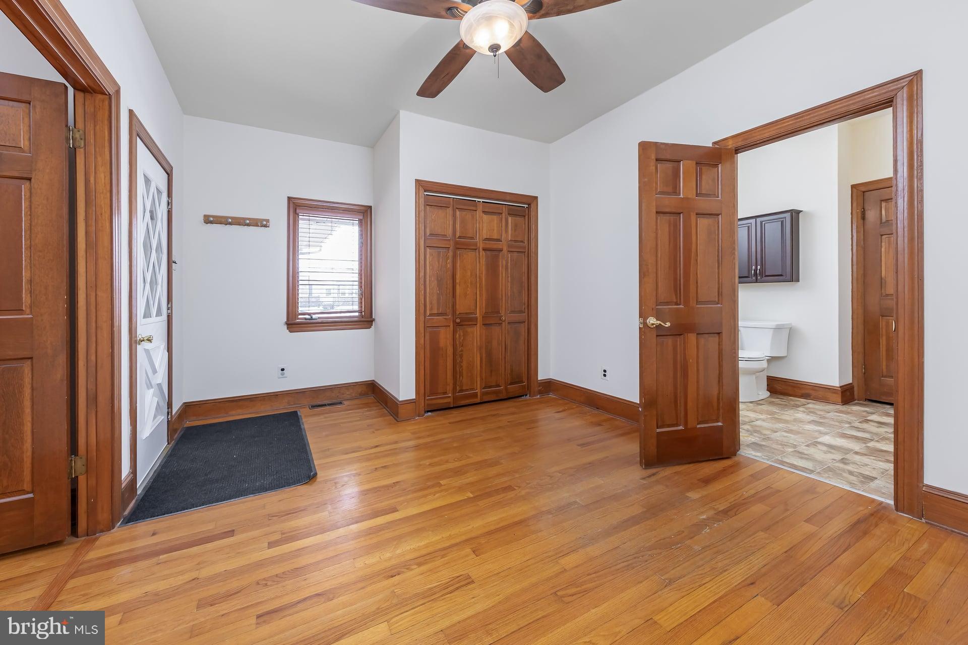 175 Queen Street West Deptford, NJ 08086 - Photo 10 of 23 a view of empty room with wooden floor and fan