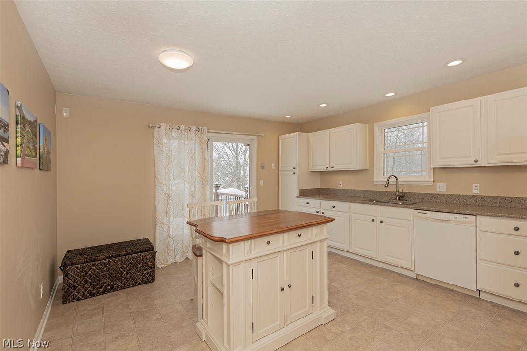 5420 Bartlett Road Bedford, OH 44146 - Photo 8 of 32 Large, bright white kitchen with center island! Slider to Trex deck. MUST SEE!