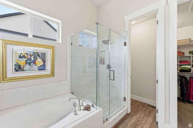 1434 West Stable Street Lindon, UT 84042 - Photo 24 of 76 Full bath with a shower stall, a bath, a spacious closet, and light wood finished floors