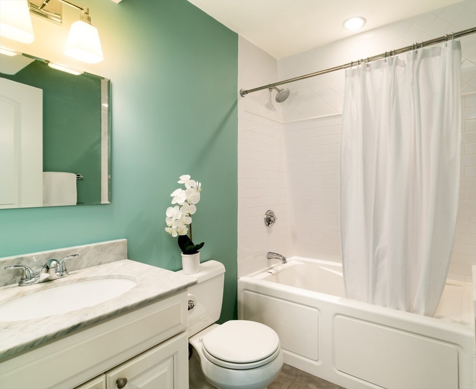 291 Lamartine Street, Unit 2 Boston, MA 02130 - Photo 12 of 18 a bathroom with a sink a toilet and shower
