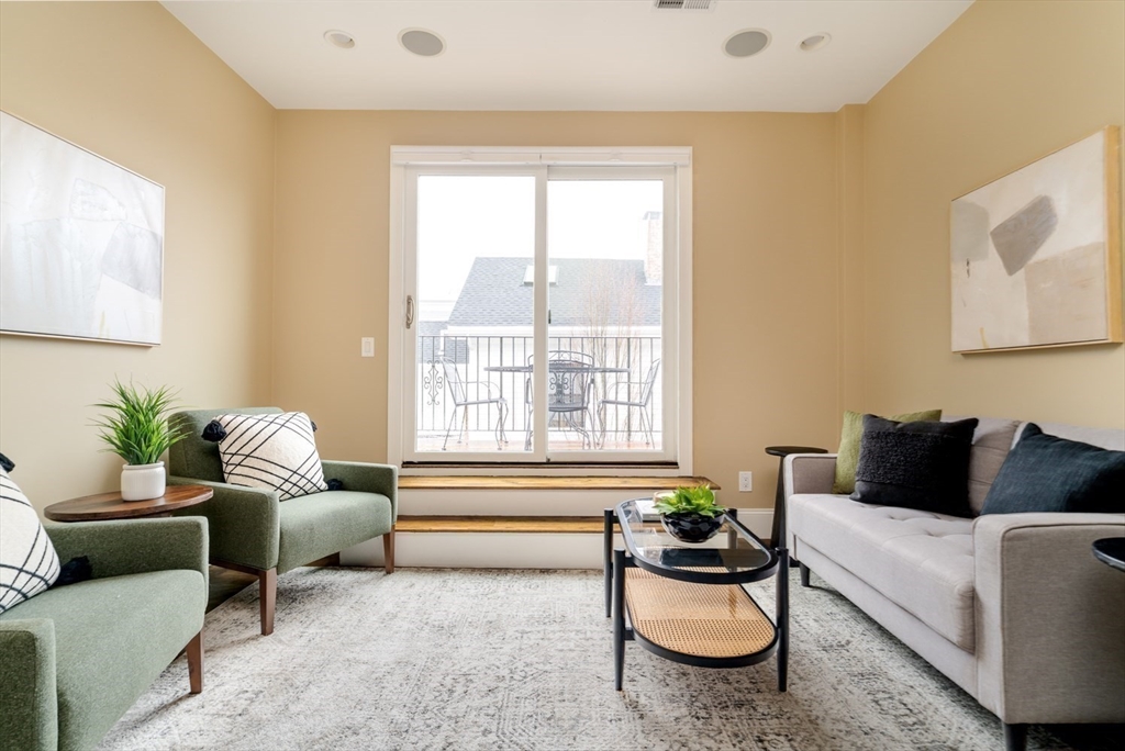 291 Lamartine Street, Unit 2 Boston, MA 02130 - Photo 7 of 18 a living room with furniture and floor to ceiling window