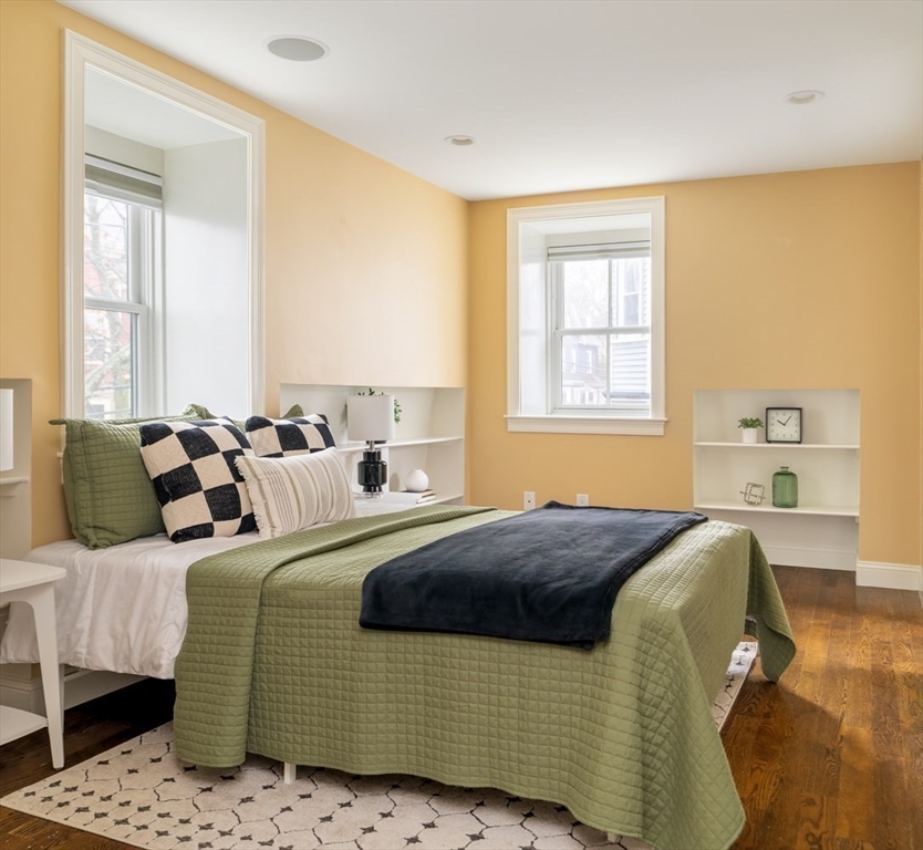 291 Lamartine Street, Unit 2 Boston, MA 02130 - Photo 8 of 18 a bedroom with a bed and wooden floor