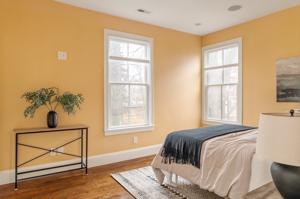 291 Lamartine Street, Unit 2 Boston, MA 02130 - Photo 10 of 18 a bedroom with a bed and a window