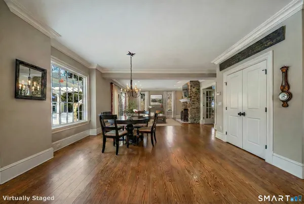 a dining room with furniture window wooden floor