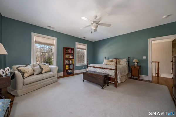 a bed room with a bed and a couch