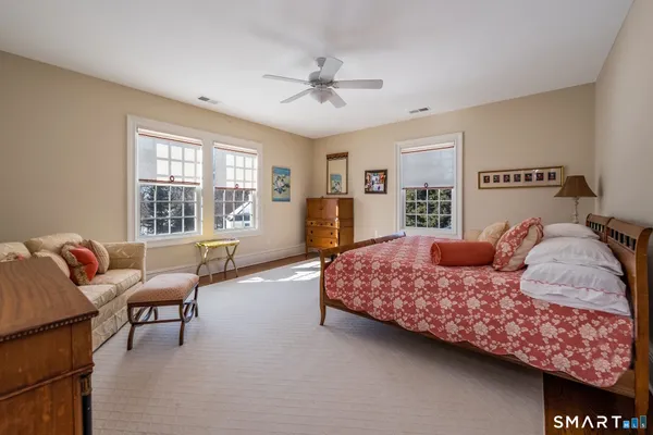 a bedroom with a bed and a couch