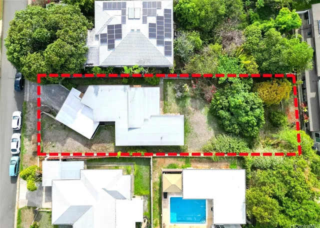 a view of swimming pool and flowers