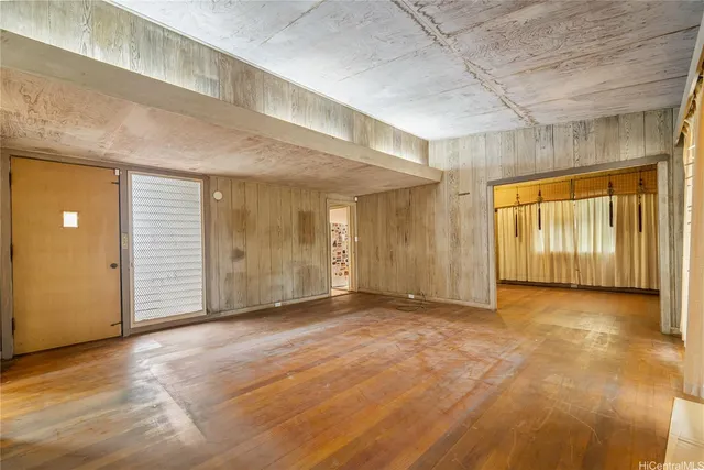 a view of an empty room with closet