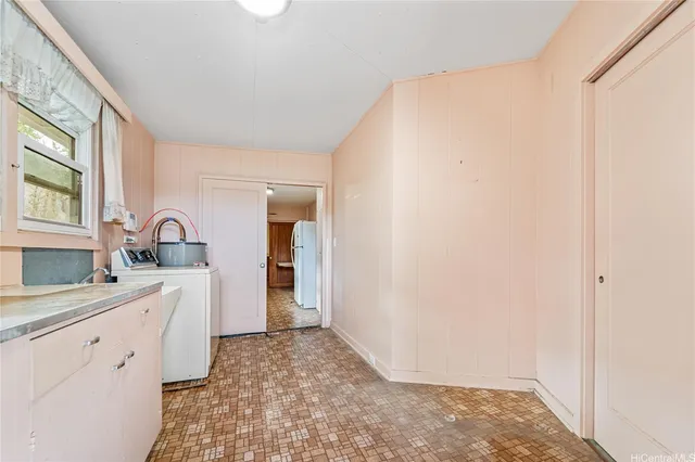 a kitchen with a sink and a stove top oven