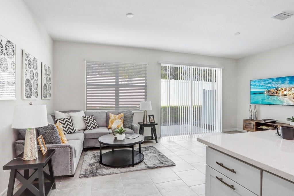 5347 Coldpine Place Seffner, FL 33584 - Photo 12 of 25 a living room with furniture and a flat screen tv