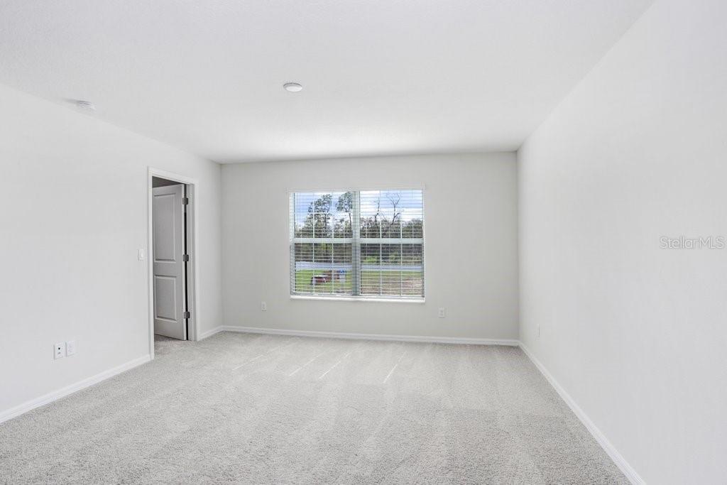 5347 Coldpine Place Seffner, FL 33584 - Photo 17 of 25 an empty room with a window