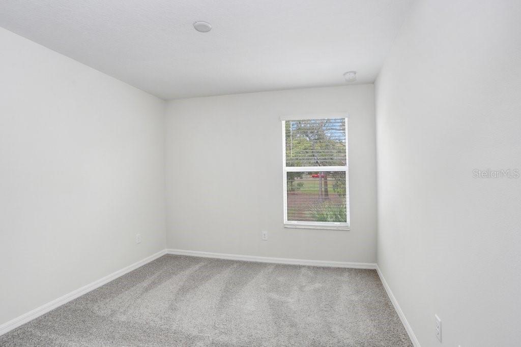5347 Coldpine Place Seffner, FL 33584 - Photo 21 of 25 an empty room with a window