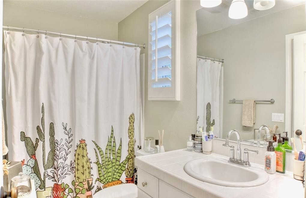 2 Evergreen Road Ladera Ranch, CA 92694 - Photo 15 of 21 a bathroom with a granite countertop sink and a mirror