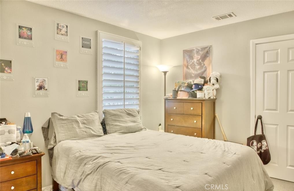 2 Evergreen Road Ladera Ranch, CA 92694 - Photo 16 of 21 a bedroom with a bed and a cabinets
