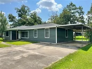 a house with trees in the background