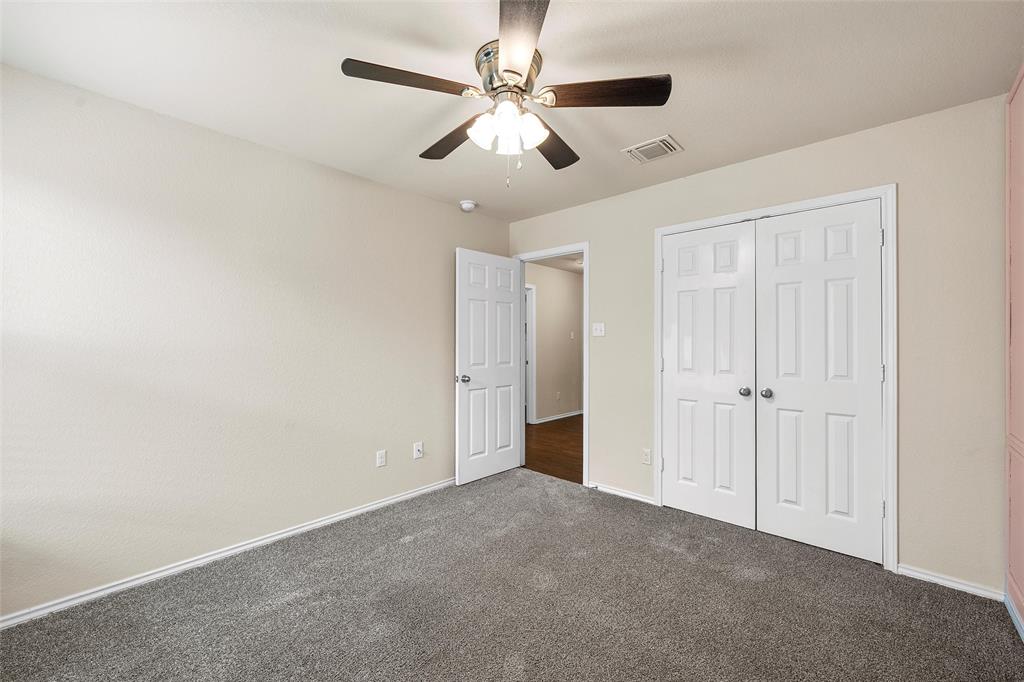 3217 Beutel Road Lorena, TX 76655 - Photo 27 of 40 Unfurnished bedroom featuring carpet, a closet, and ceiling fan