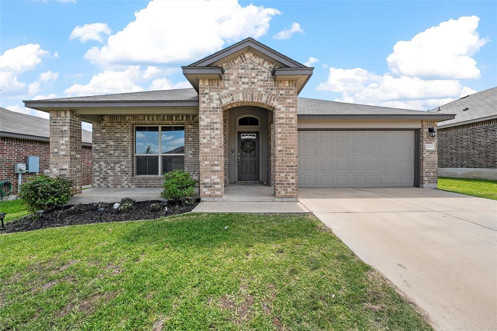 3217 Beutel Road Lorena, TX 76655 - Photo 3 of 40 View of front facade featuring brick siding, an attached garage, and driveway