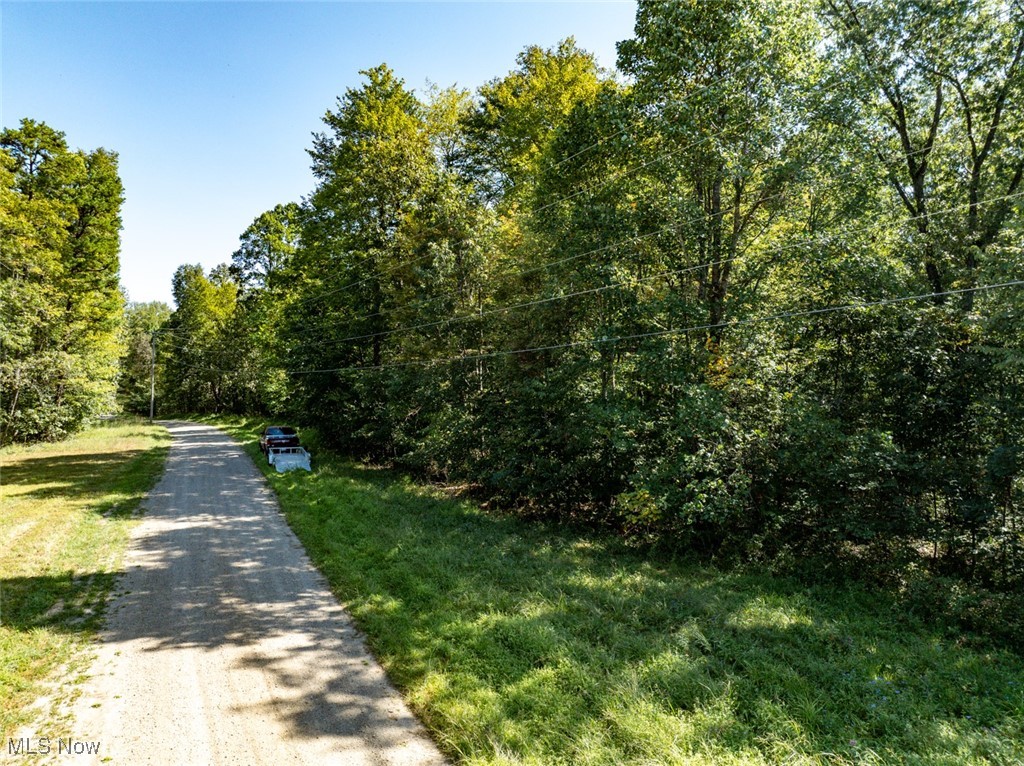 Lot 2 Shinn Road Stockport, OH 43787 - Photo 2 of 17 View of dirt / gravel road with a forest view