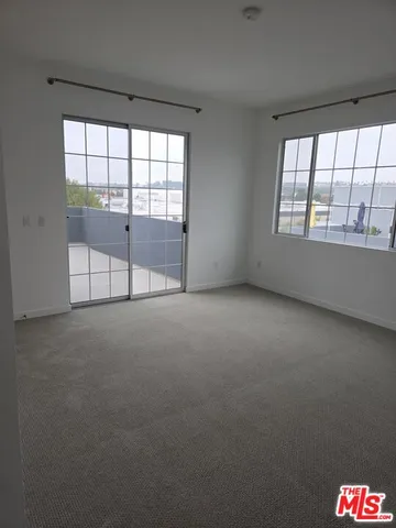 a room with cabinets and appliances