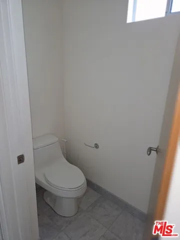 a view of swimming pool with a patio and a yard