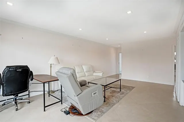 a living room with furniture and a table