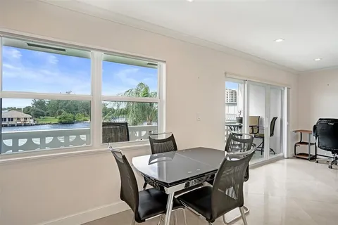 a kitchen with cabinets appliances a sink and a counter top space