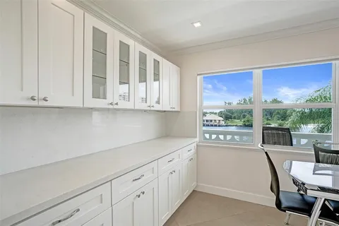 a view of a balcony with table and chairs