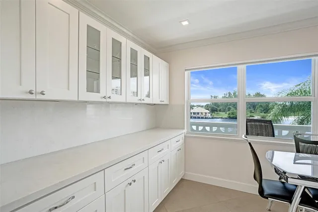a view of a balcony with table and chairs